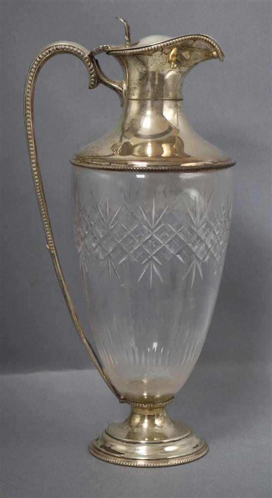 A late Victorian silver mounted cut glass claret jug with beaded rims, Goldsmiths and Silversmiths, London 1899, 27.5cm.